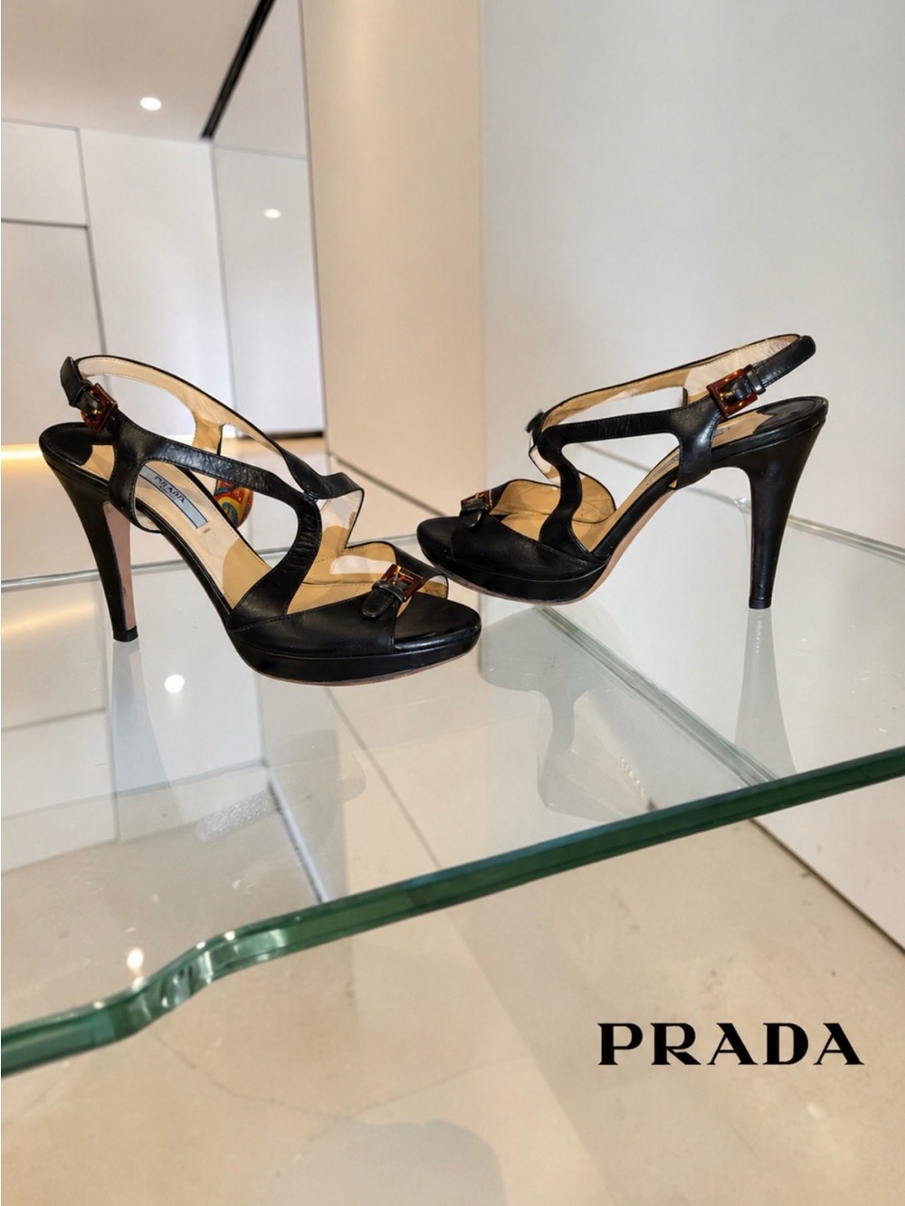 AUTHENTIC PRADA BLACK LEATHER TORTOISE BUCKLE STRAPY 4” HEEL. ELEGANT-SEXY